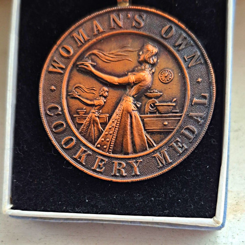 Woman own cookery medal - woman’s,